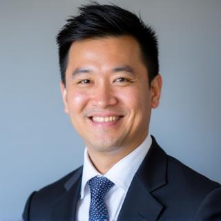 Professional headshot of Marcus Chen.